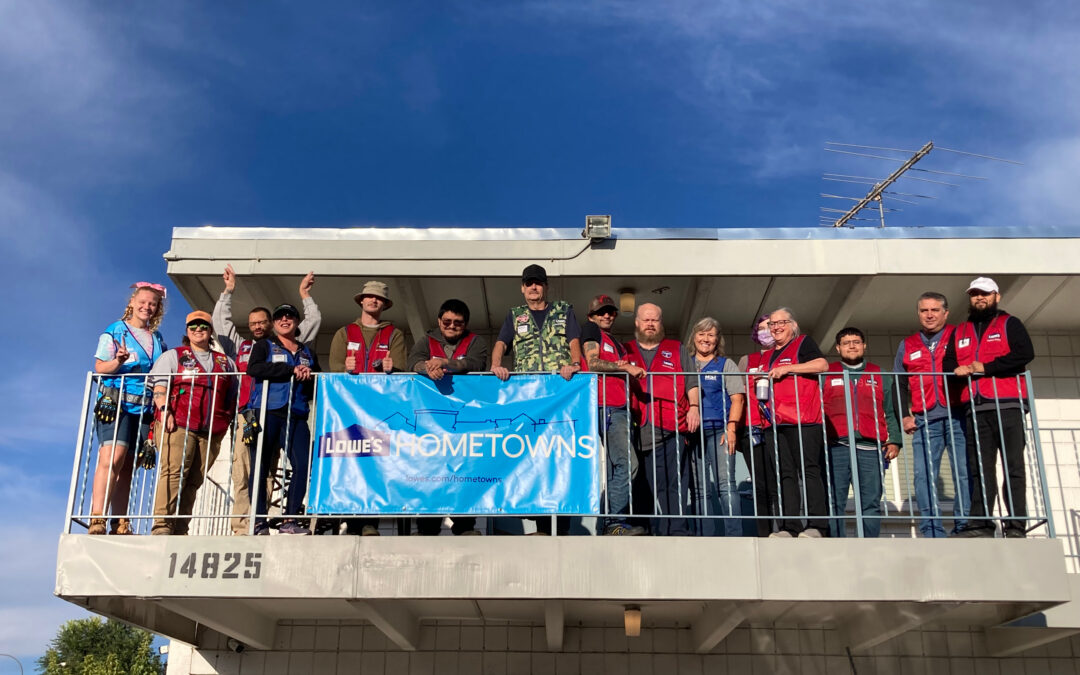 Lowe's Associates celebrate with banner on balcony