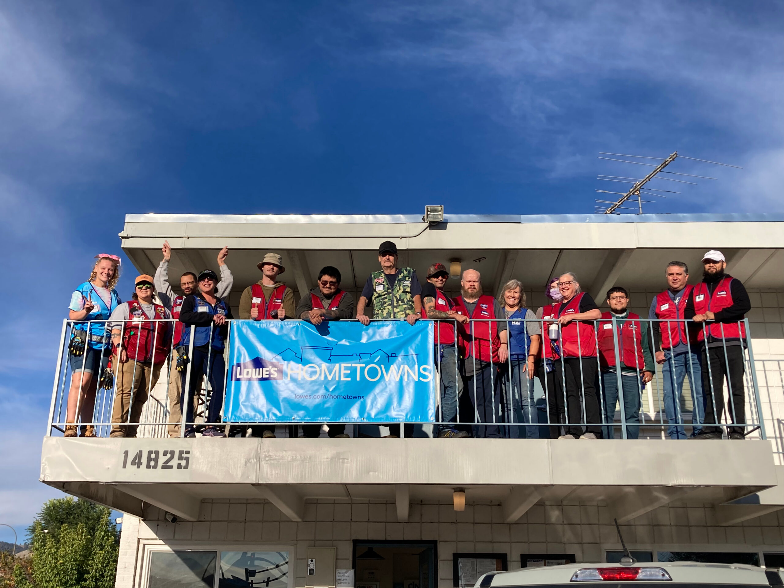 Lowe's Associates celebrate with banner on balcony